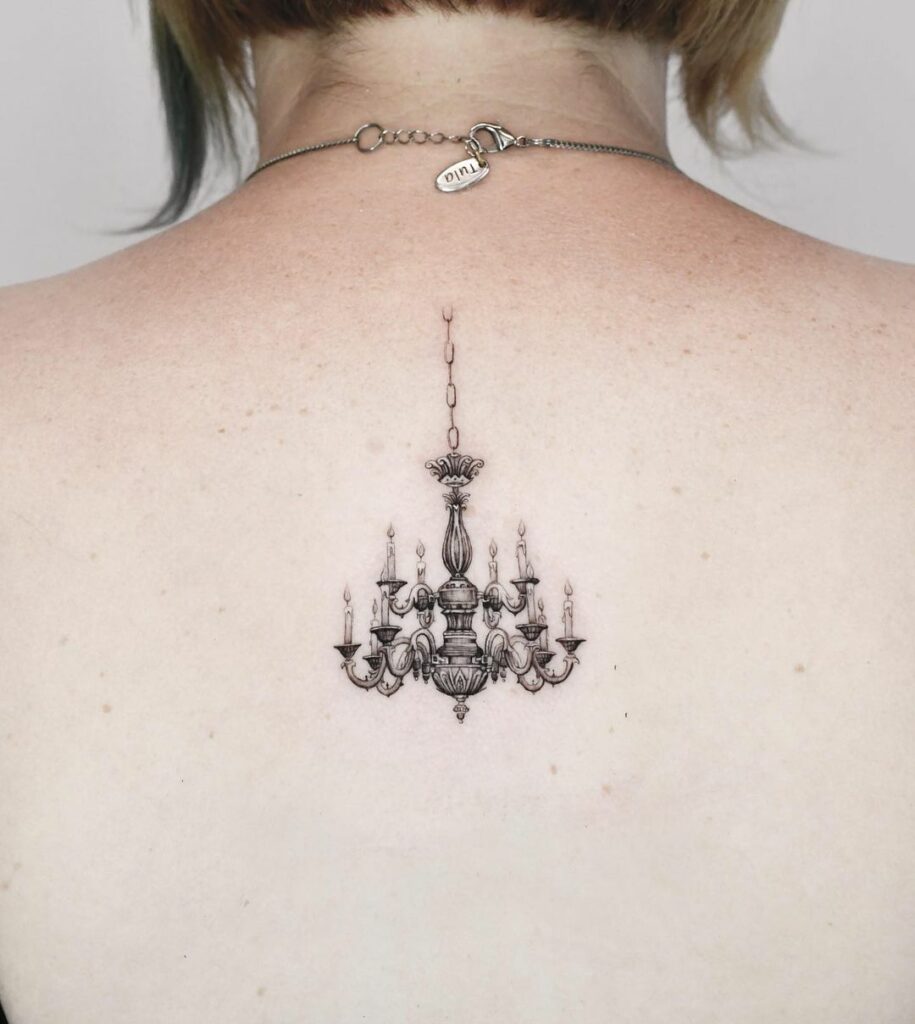11+ chandelier tattoo ideas you'll have to see to believe! 11 Chandelier Sternum Tattoo