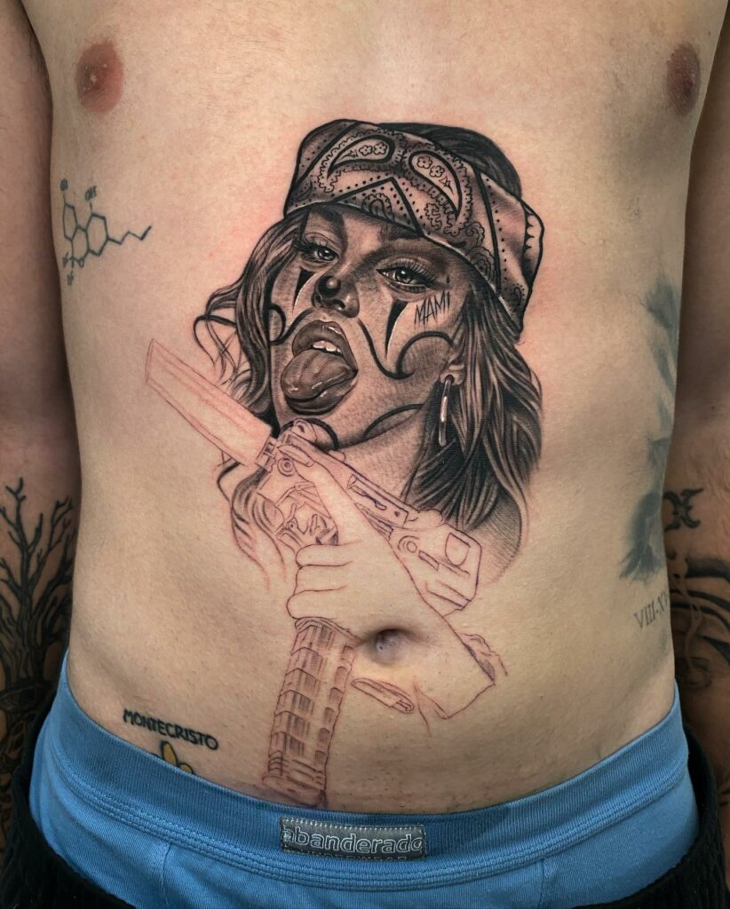 10+ Chicano Tattoo Lettering Ideas That Will Blow Your Mind 16 Chicano Woman Tattoo With Gun