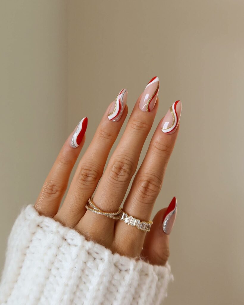 Shine Bright with 30 Red and Gold Christmas Nail Ideas in 2024 22 Whimsical Christmas Swirls on Red Nails