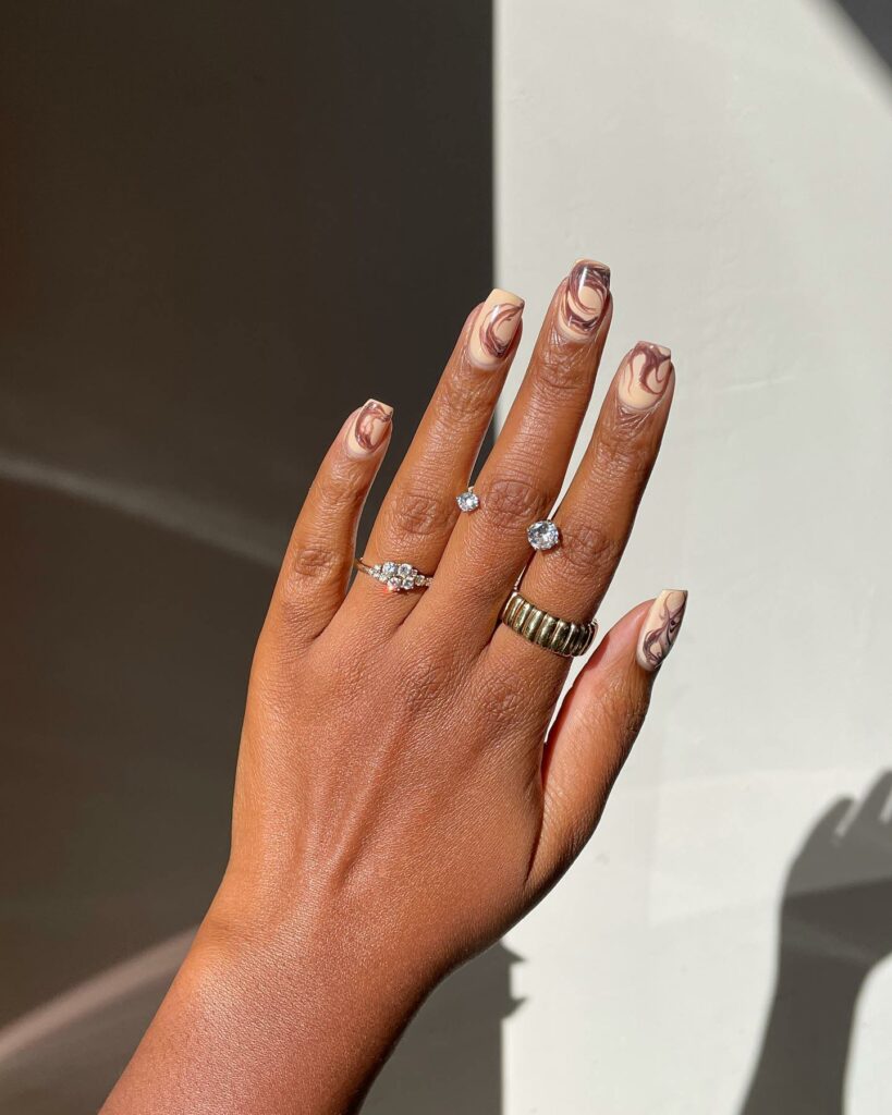 Bring Warmth with 20 Light Brown Nail Ideas in 2024 18 Abstract Swirl Light Brown Nails