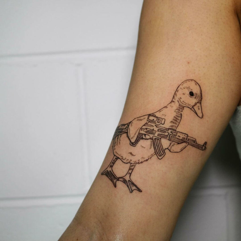 11+ Common Tattoo Ideas That Will Blow Your Mind! 17 Common Tattoo Of Duck With A Gun
