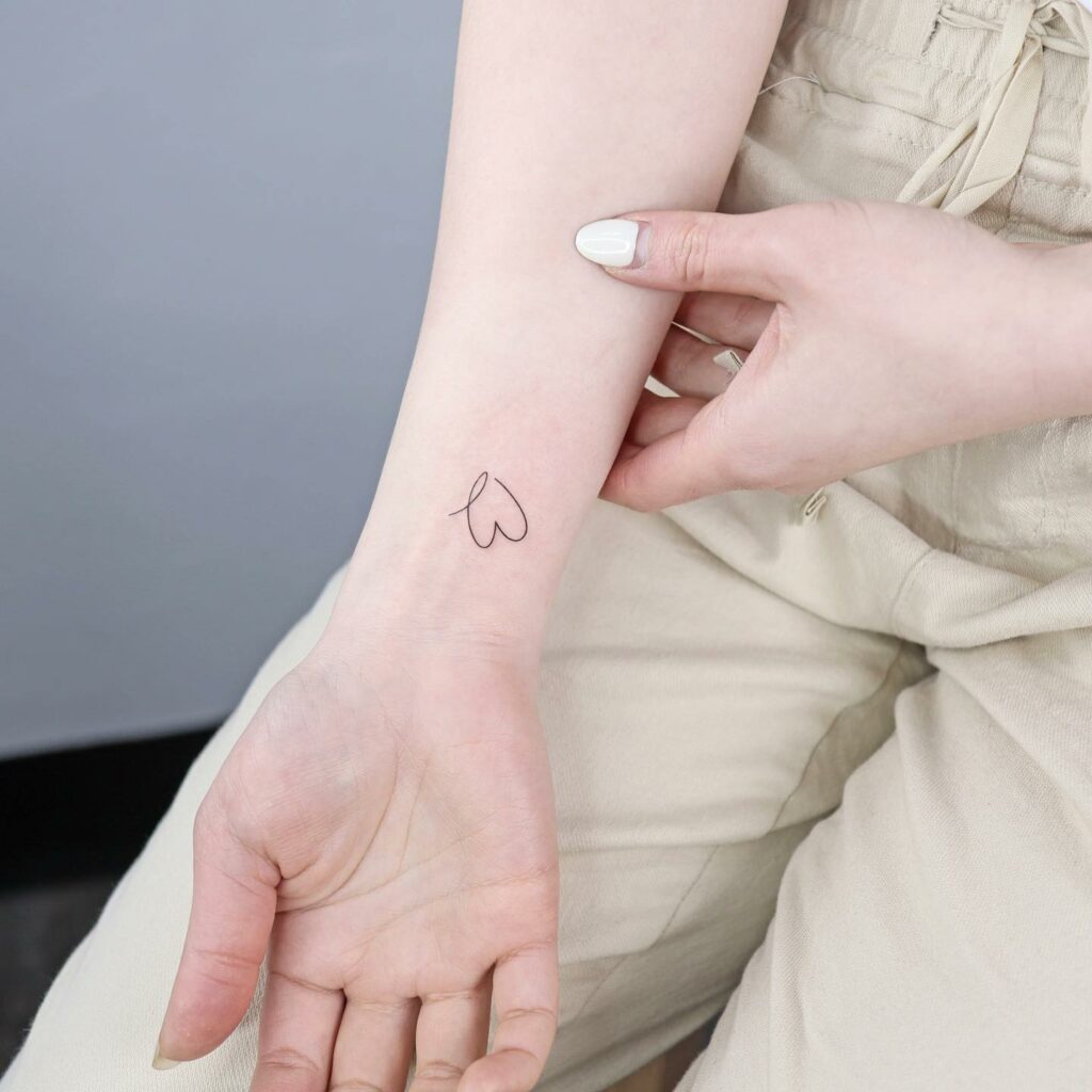 11+ Wrist Heart Tattoo Ideas That Will Blow Your Mind! 11 Continuous Line Outline Wrist Heart Tattoo