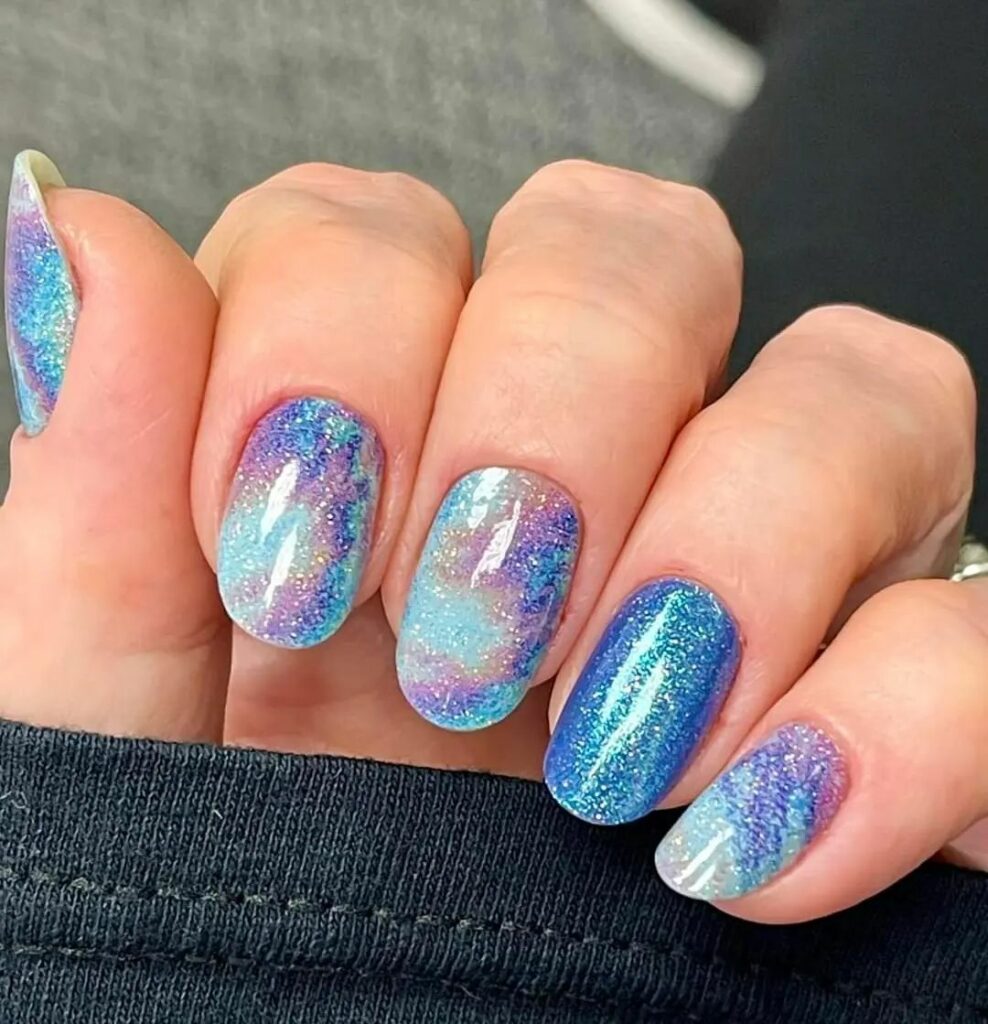 Get Artsy with 25 Tie-Dye Nail Designs in 2024 27 Cosmic Tie-Dye Nails