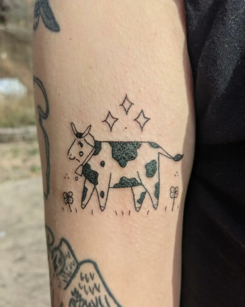 12+ Minimalist Cow Tattoo Ideas To Inspire You! 19 Cow In the Garden Tattoo
