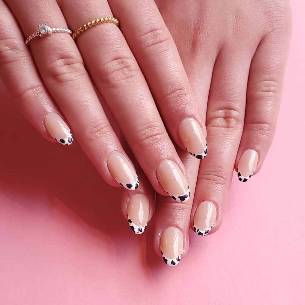 22 Latest Short Black French Tip Nail Ideas To Try In 2024! 13 Cow Print on White Short French Nails