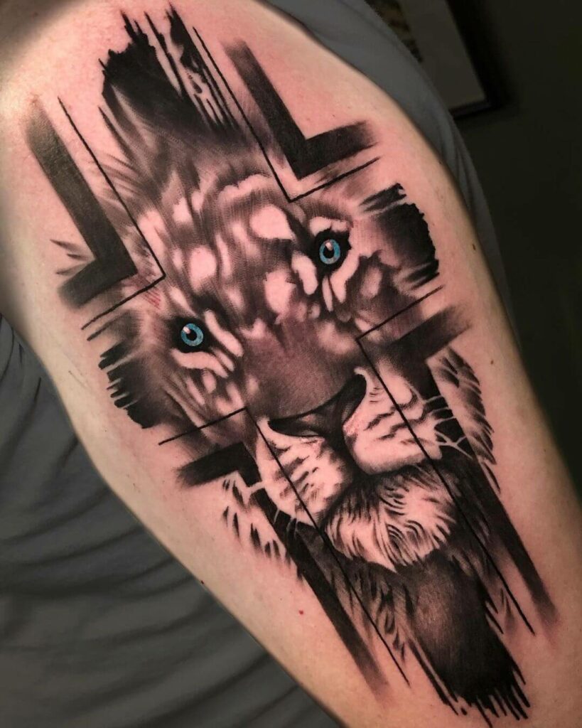 12+ Christian Half Sleeve Tattoo Ideas To Inspire You! 14 Cross with Lion Tattoo