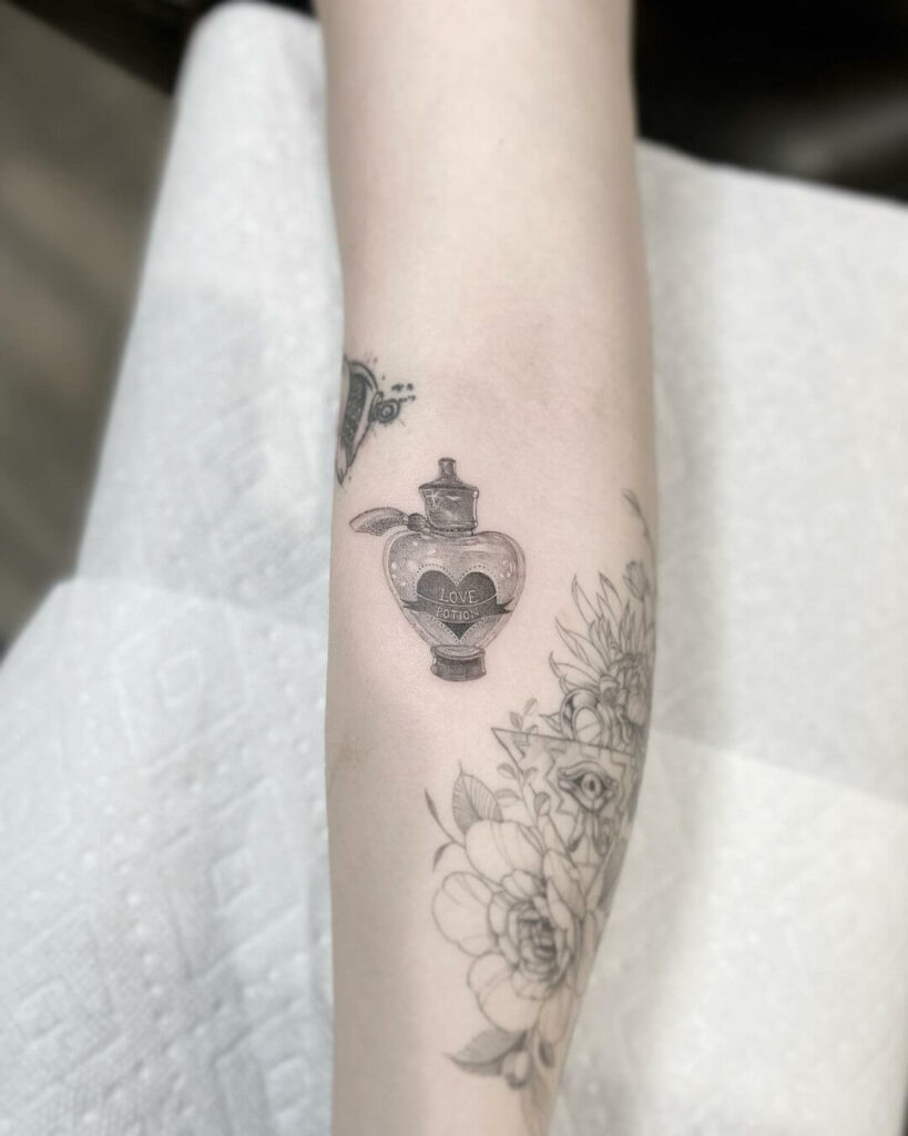 11+ Dainty Tattoo Ideas That Will Blow Your Mind! 19 Dainty Tattoo Of Magical Love Potion