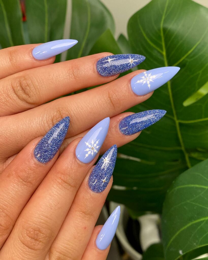 Get Festive with 20 Stiletto Christmas Nail Ideas in 2024 14 Enchanted Blue Stiletto Christmas Nails