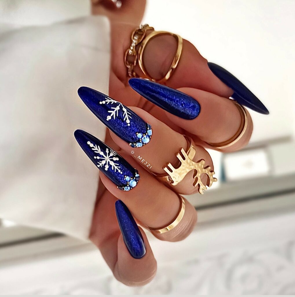 Get Festive with 20 Stiletto Christmas Nail Ideas in 2024 18 Festive Blue Stiletto Christmas Nails