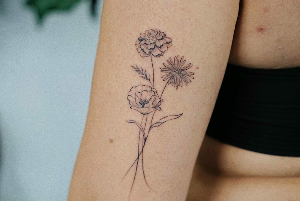 11+ October Birth Flower Tattoo Ideas That Will Blow Your Mind! 14 Flower Bouquet Tattoos With Marigold And Cosmos