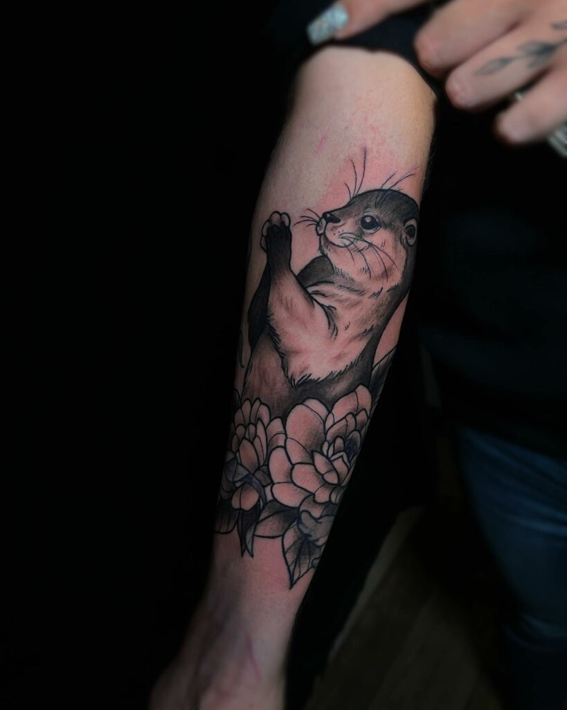 10+ Sea Otter Tattoo Ideas That Will Blow Your Mind! 15 Forearm Otter Tattoo With Flowers