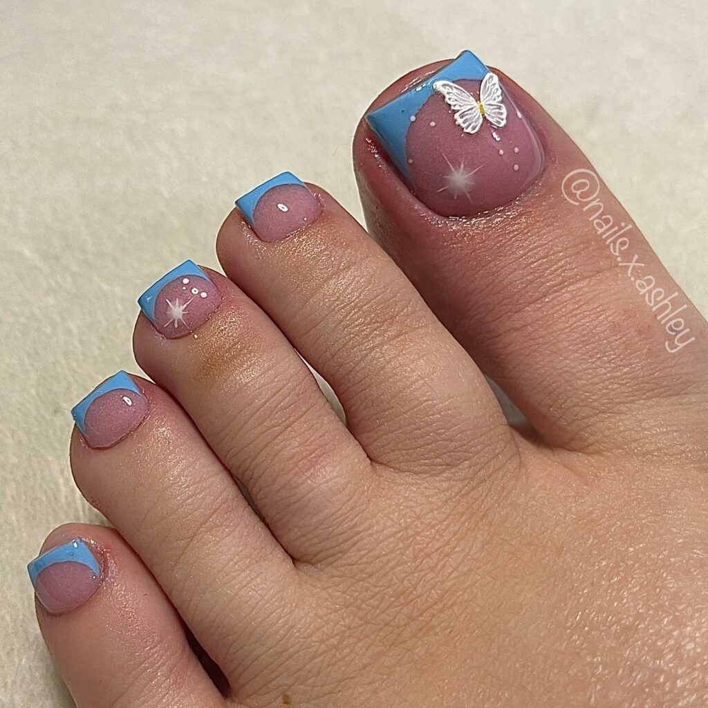 20 Latest Acrylic Pedicure Ideas To Try In 2024! 15 French Blue Acrylic Pedicure with Butterflies