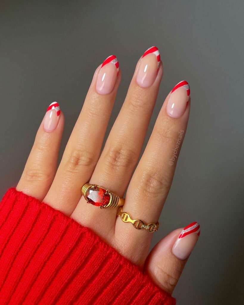 Celebrate with 30 Nude Christmas Nail Ideas in 2024 19 French Candy Cane Nude Christmas Nails