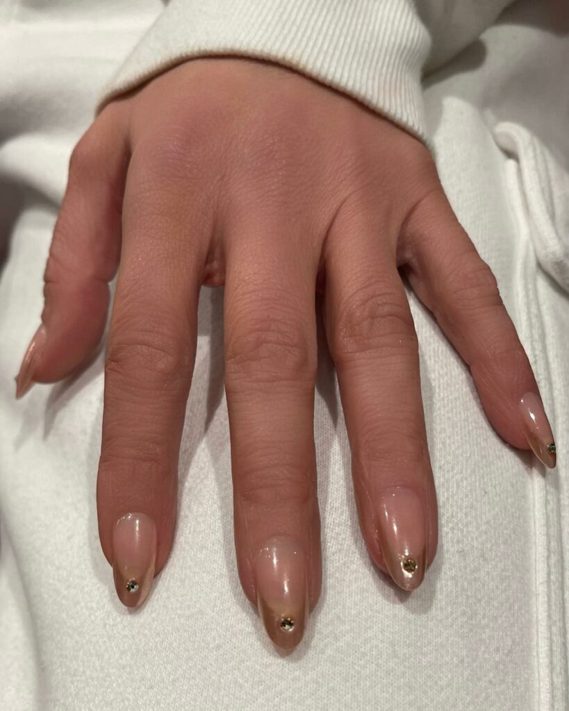 Shine Bright with 50 Rose Gold Nail Designs for 2024 44 French rose gold nails