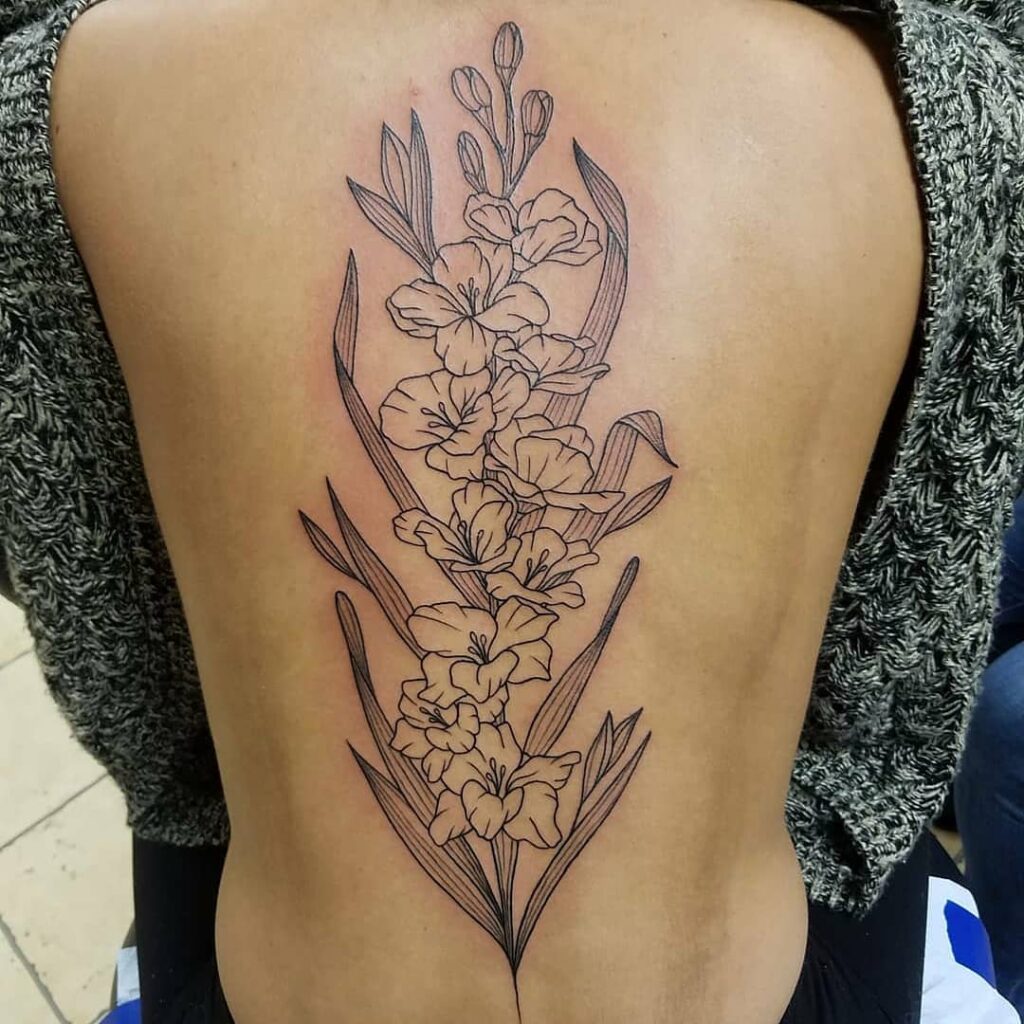 11+ Flower Spine Tattoo Ideas That Will Blow Your Mind! 14 Gladiolus Flower Tattoo Ideas With Black Ink