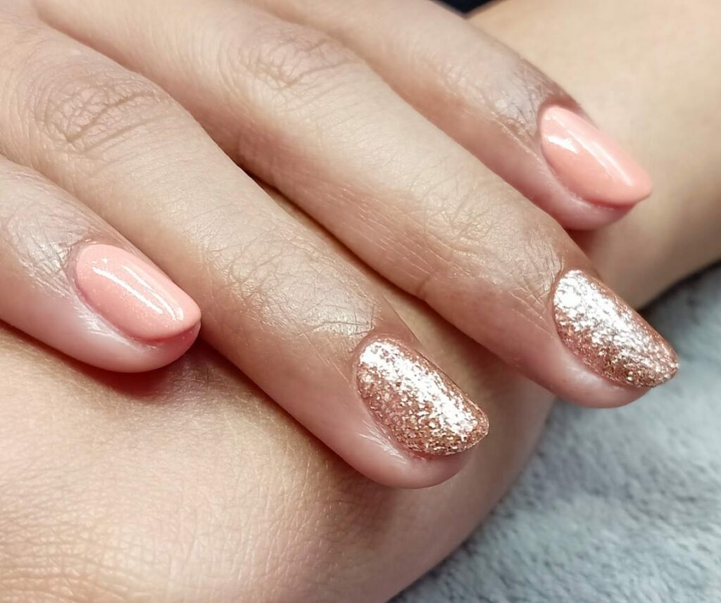 Shine Bright with 50 Rose Gold Nail Designs for 2024 27 Glitter rose gold nail designs