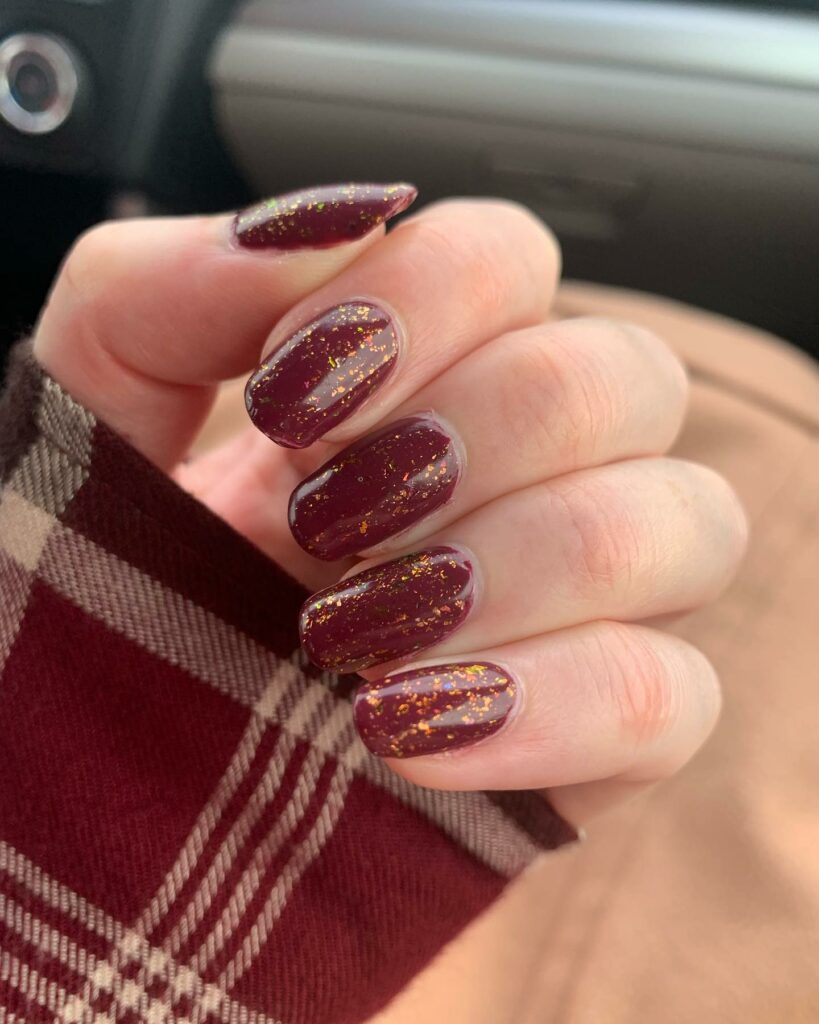 27 Latest Maroon Nail Designs To Try In 2024! 29 Glittery Gold Highlights on Maroon Nails