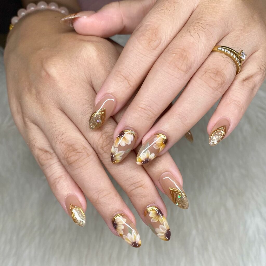 30 Latest Round Nail Designs To Try In 2024! 27 Gold Nail Foil and Floral Design on Round Nails