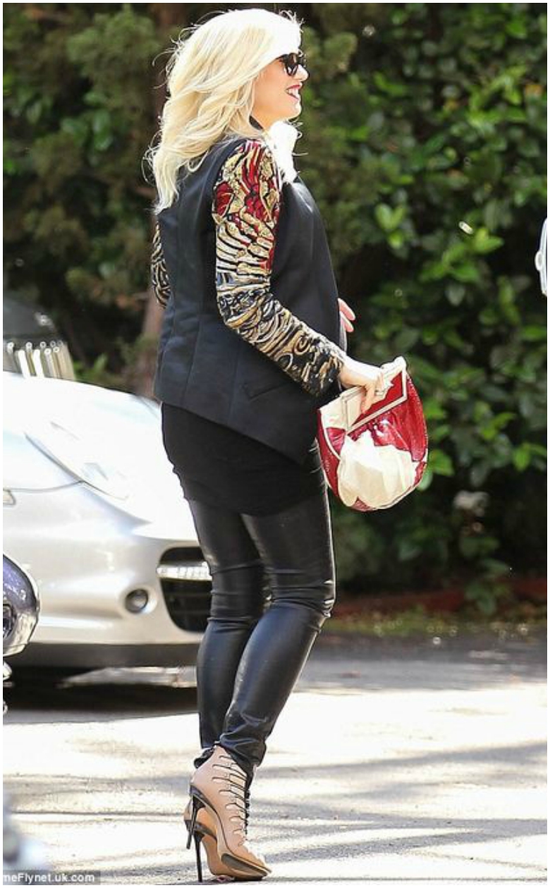 What to Wear to a Baby Shower 30 Pregnant Gwen Stefani in leather trousers and black blazer with colourful sleeve detail