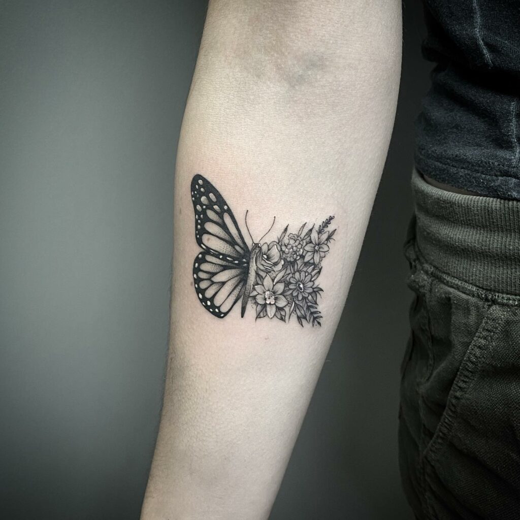11+ Butterfly Tattoo On Arm Ideas That Will Blow Your Mind 19 Half Butterfly Tattoo With Floral Design In Black