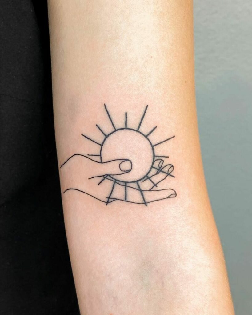 10+ Small Sun Tattoo Designs That Will Blow Your Mind! 19 Hand Holding Simple Sun Tattoo
