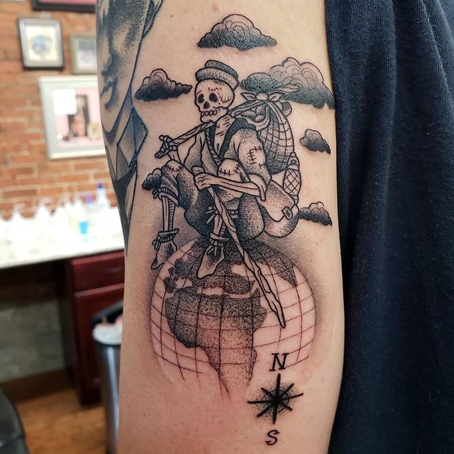 12+ Hiker Tattoo Ideas To Inspire You! 20 Hiker Skeleton Sitting On The Globe Tattoo
