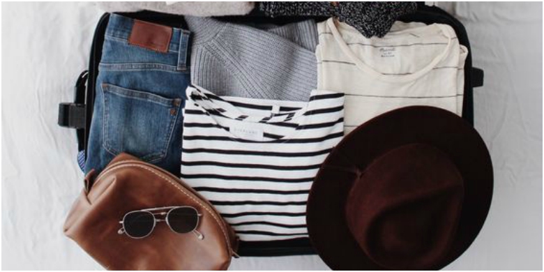 How to Create the Perfect Capsule Wardrobe 18 Suitcase filled with holiday clothes