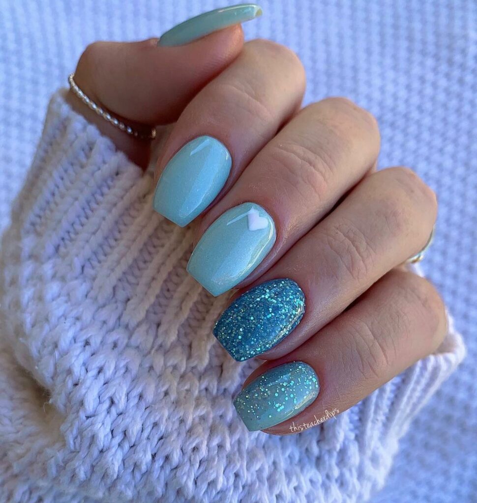 27 Latest Glitter Ombré Nail Designs To Try In 2024! 18 Wintry Icy Blue Glitter Ombré Nails
