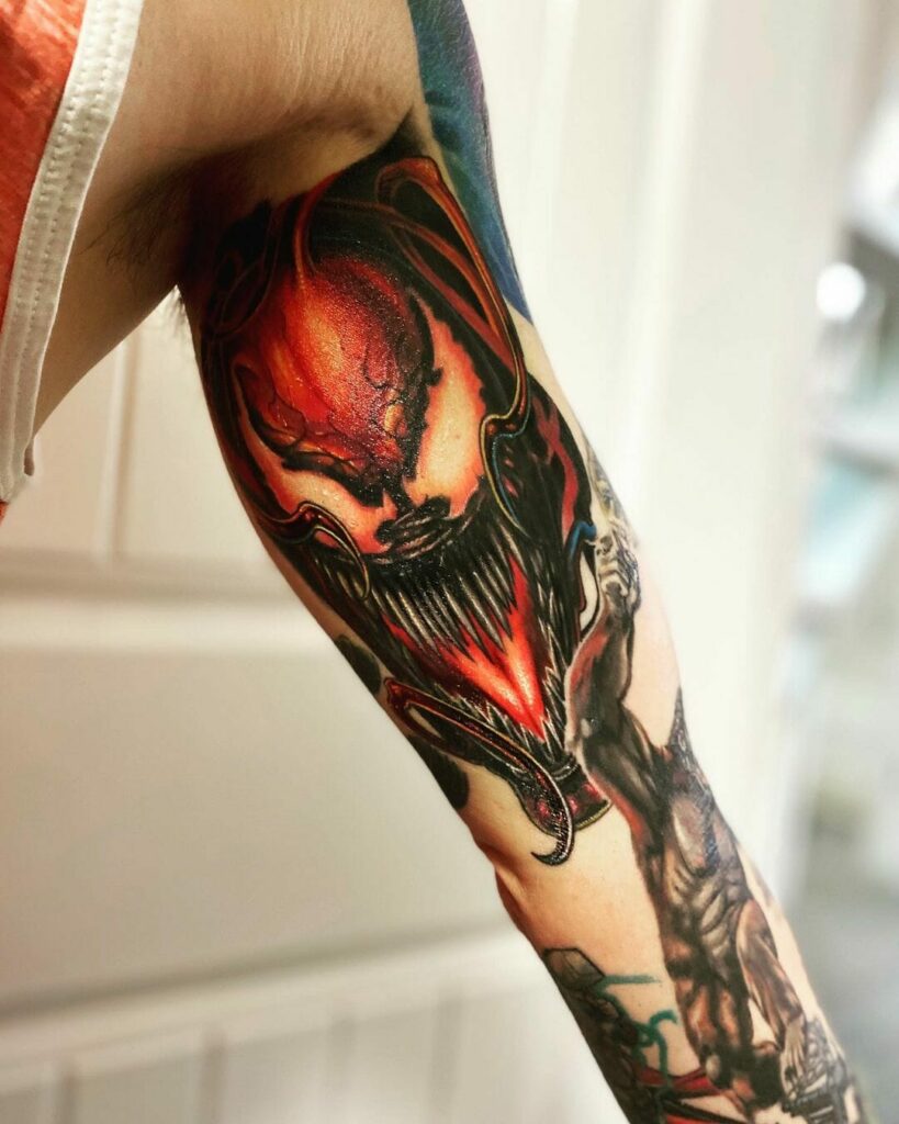 12+ Carnage Tattoo Ideas To Inspire You! 13 Inner Bicep Carnage Tattoo