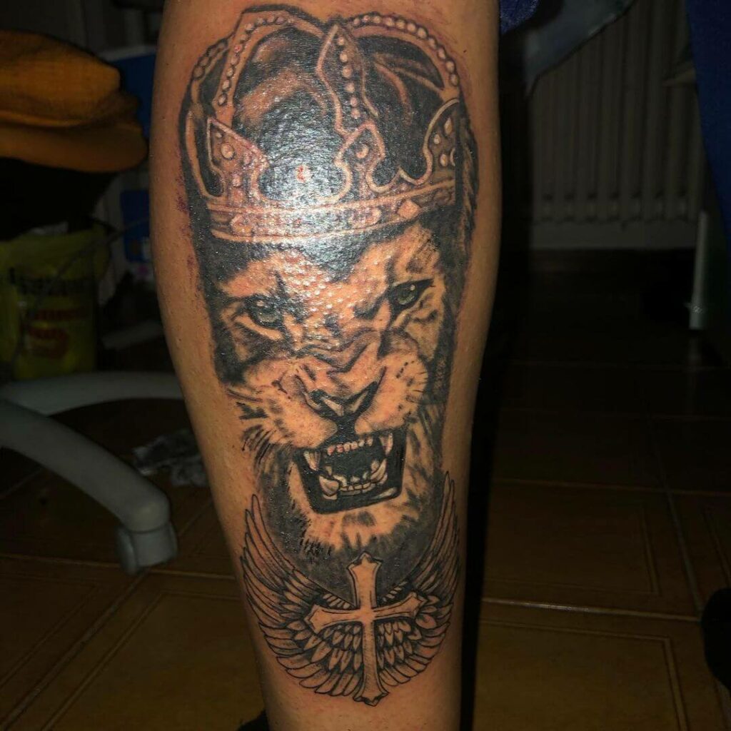 11+ Lion And Cross Tattoo Ideas That Will Blow Your Mind! 19 King Lion with Cross Tattoo
