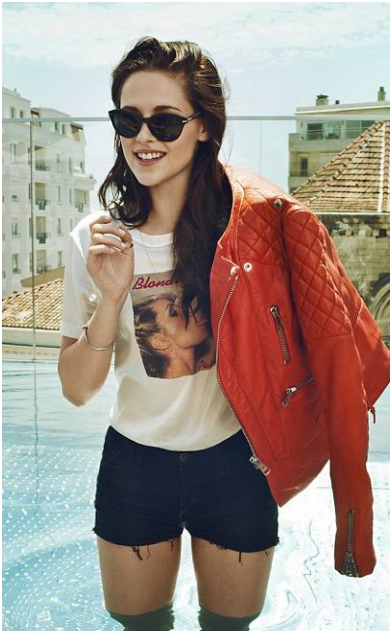 How to Wear a Leather Jacket All Year Round 31 Kristen Stewart orange quilted leather jacket white t-shirt black shorts