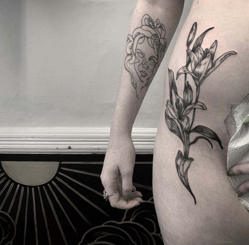 10+ Front Hip Tattoo Ideas That Will Blow Your Mind! 15 Lilies On The Front Hip Tattoo