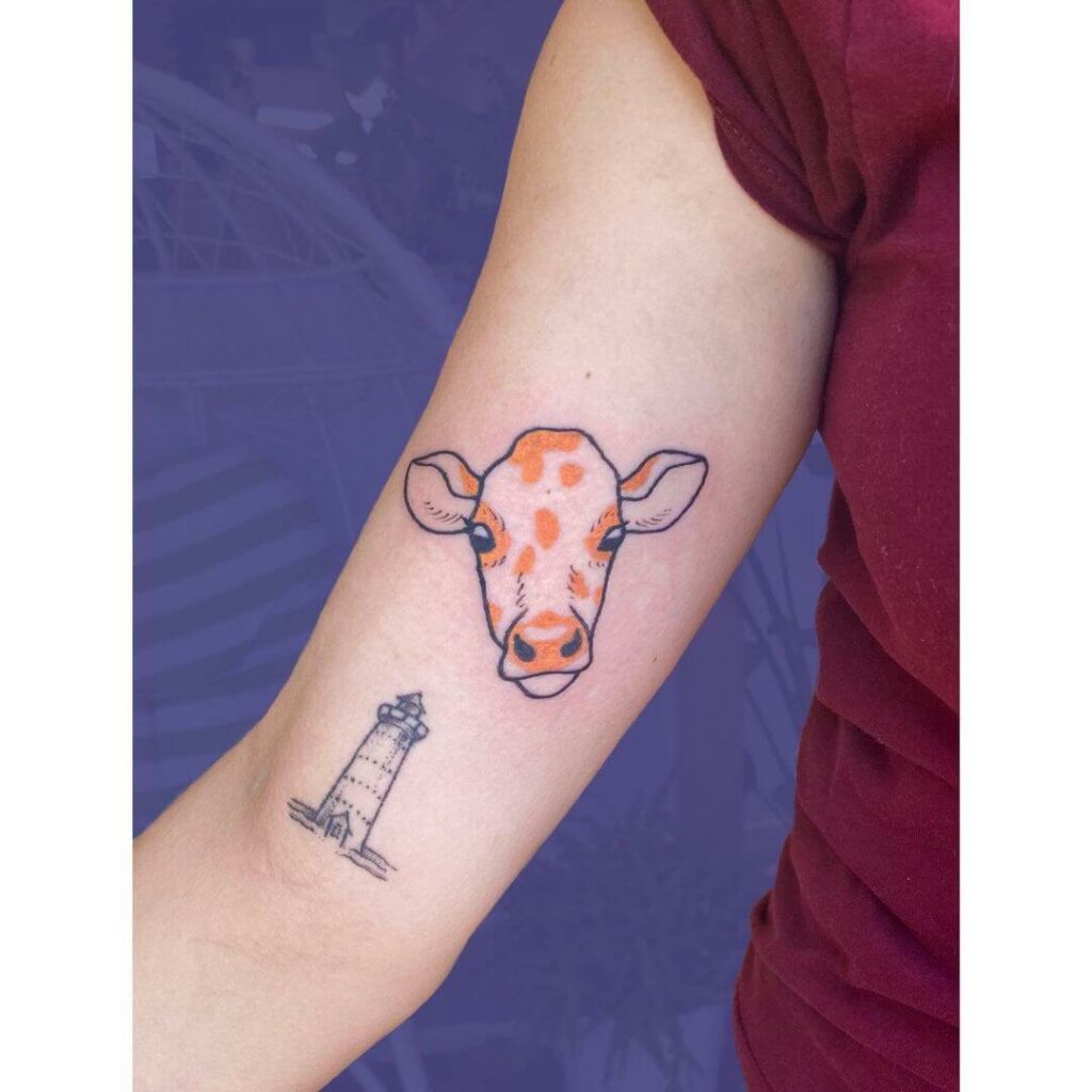 12+ Minimalist Cow Tattoo Ideas To Inspire You! 14 Little Orange Cow Tattoo
