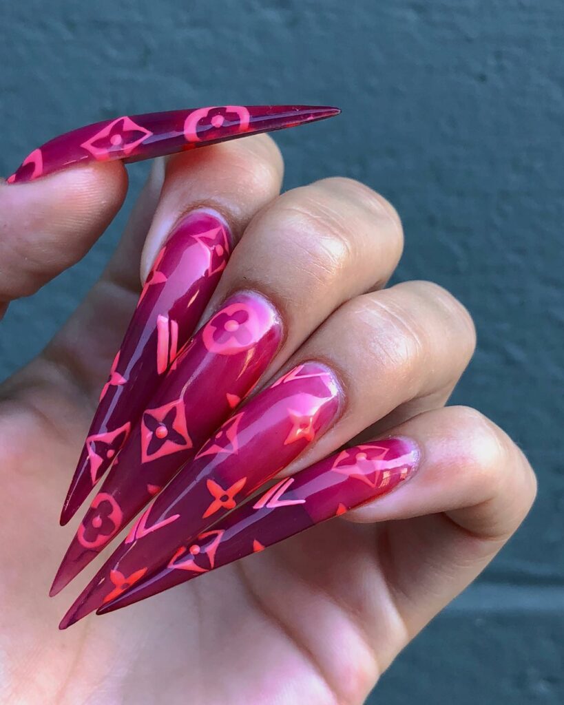 25 Latest Louis Vuitton Nails To Try In 2024 28 Bold Long Stiletto Ombré Nails with Louis Vuitton