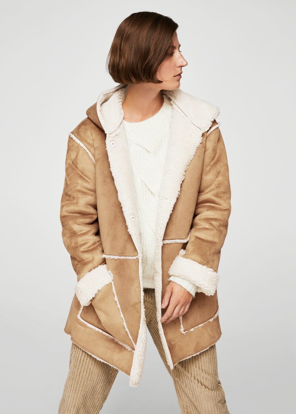 MANGO Faux shearling-lined coat – $129.99 MANGO Faux shearling-lined coat