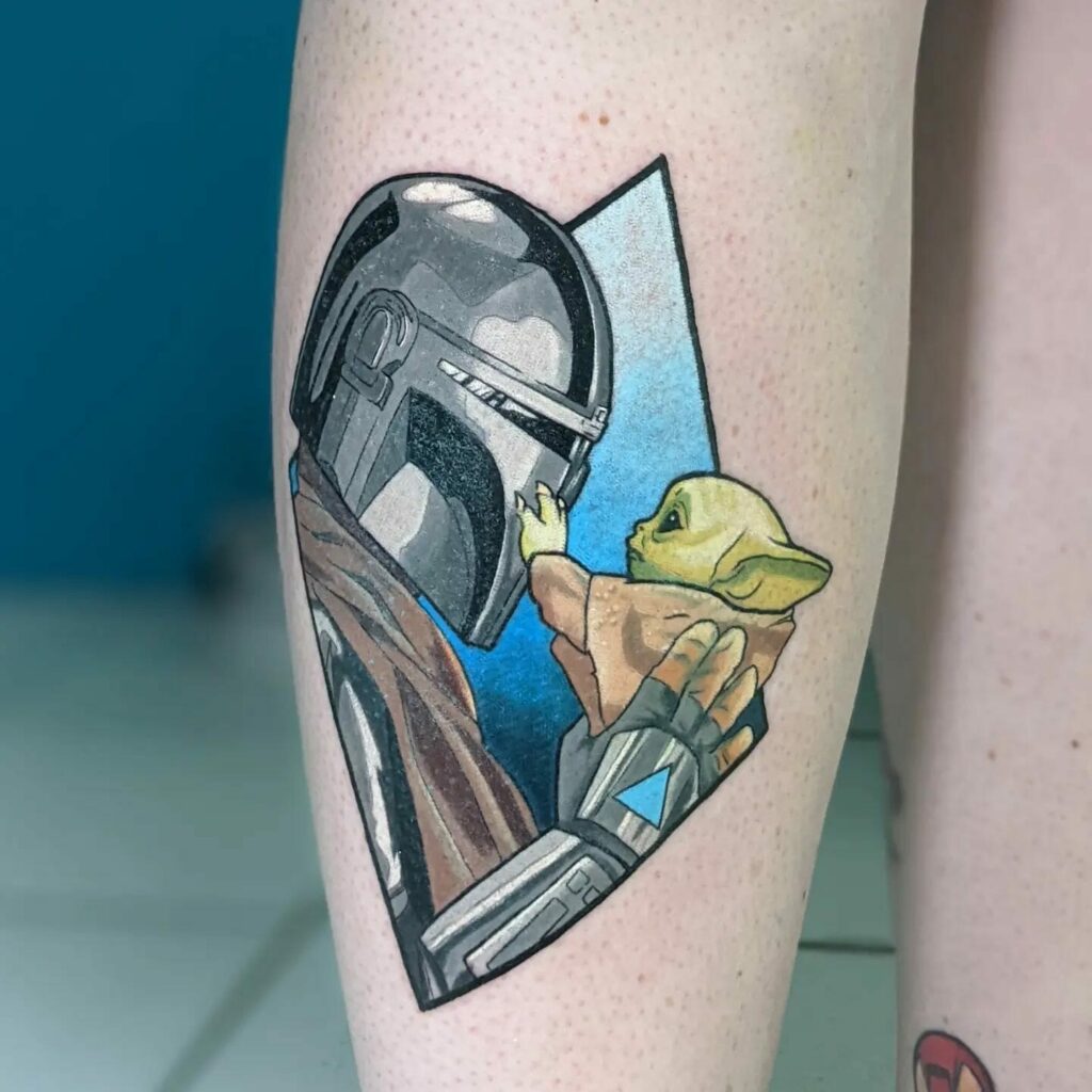 10+ Mandalorian Helmet Tattoo Ideas That Will Blow Your Mind! 16 Mandalorian Helmet And Baby Yoda Star Wars Tattoo