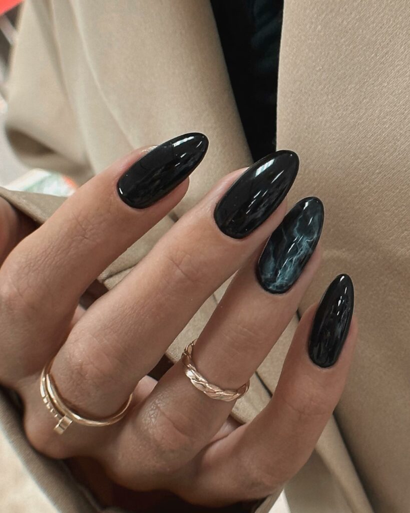 30 Latest Black Almond Nail Ideas To Try In 2024! 21 Marbled Elegance Black Almond Shaped Nails