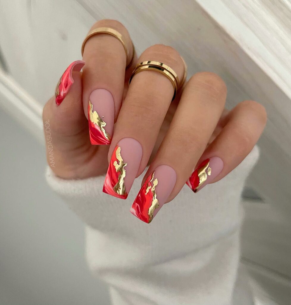 Shine Bright with 30 Red and Gold Christmas Nail Ideas in 2024 11 Marble Elegance with Red and Gold Christmas Nails