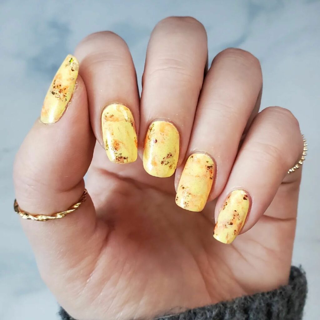 50 Latest February Yellow Nail Designs To Try in 2024! 11 Marble Yellow Nails