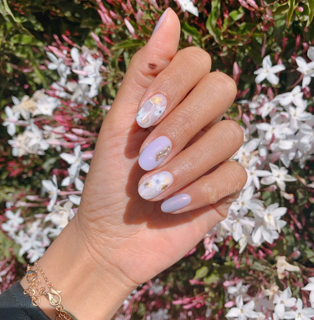 Indulge in 40 Marble Nail Designs for 2024 48 Marble with Flower Accents
