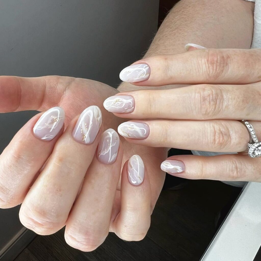 Discover 40 Short White Nail Designs for 2024 35 Marbled and white short nails