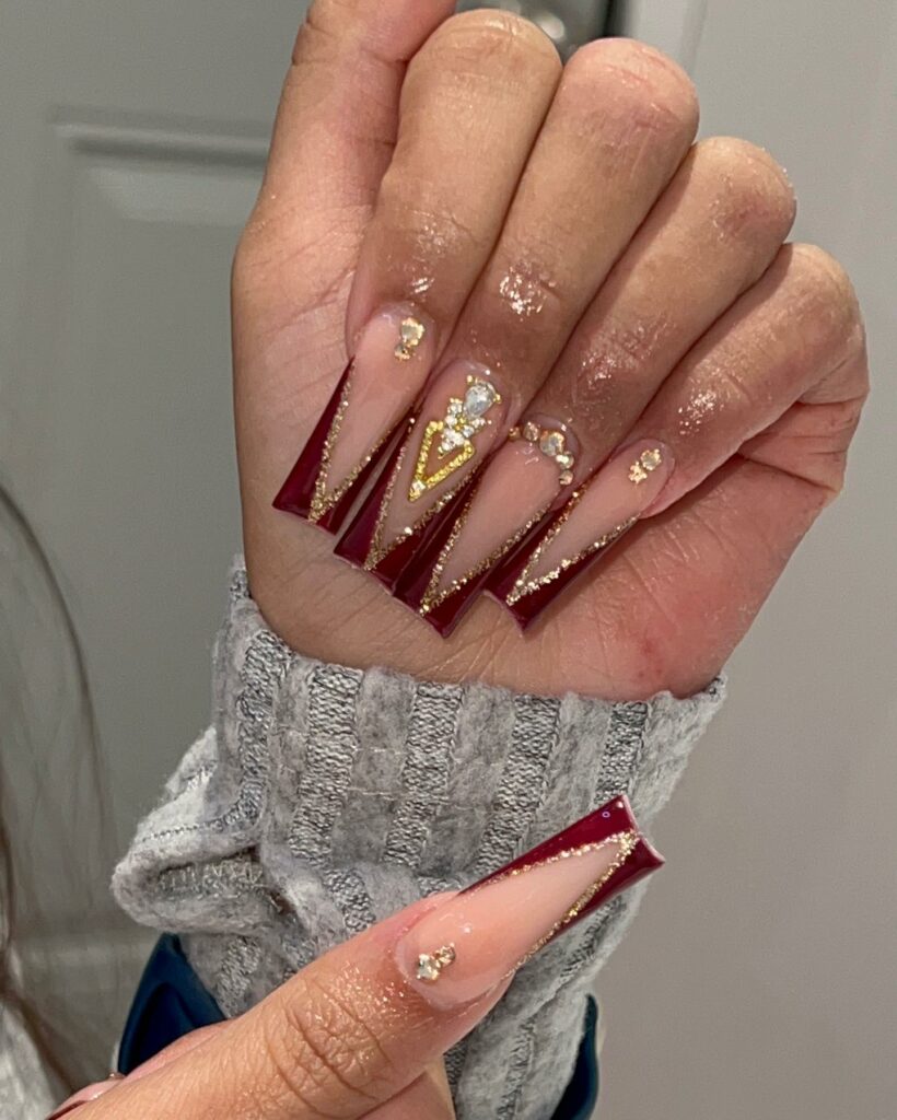 27 Latest Maroon Nail Designs To Try In 2024! 21 Maroon Nails with Gold Glitter Acrylic