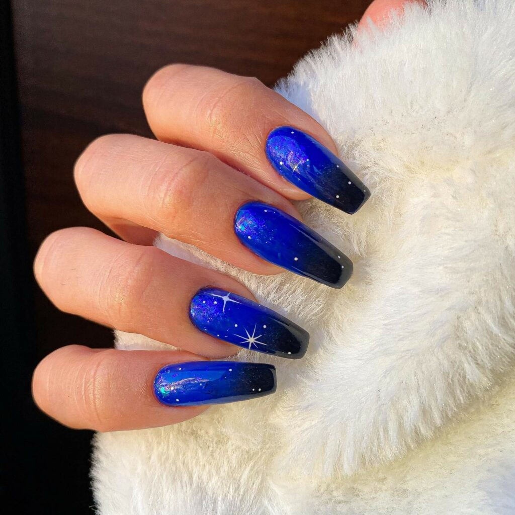 Experiment with 30 Stunning Blue Ombré Nails for 2024 32 Midnight Sky blue ombre nails