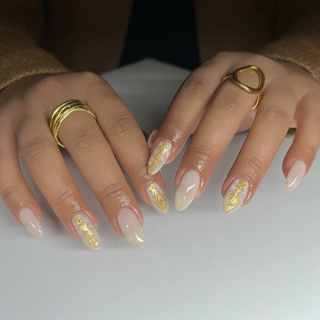 24 Latest Long Nail Designs To Try In 2024! 20 Milky White Marble Nails with a Touch of Gold