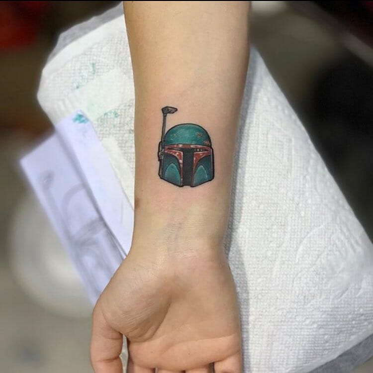 10+ Mandalorian Helmet Tattoo Ideas That Will Blow Your Mind! 12 Miniature Boba Fett Wrist Tattoo