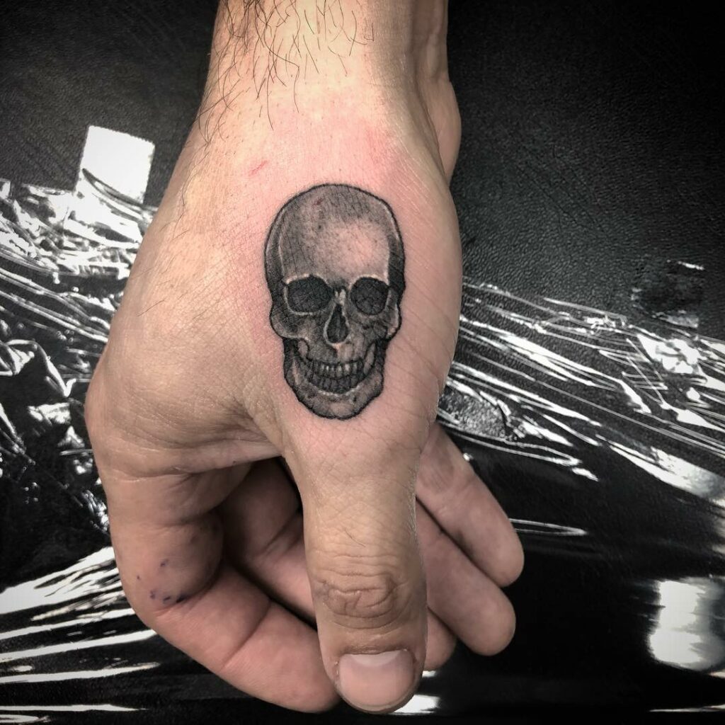 11+ Skeleton Face Hand Tattoo Ideas That Will Blow Your Mind! 14 Minimalist Skeleton Face Hand Tattoo