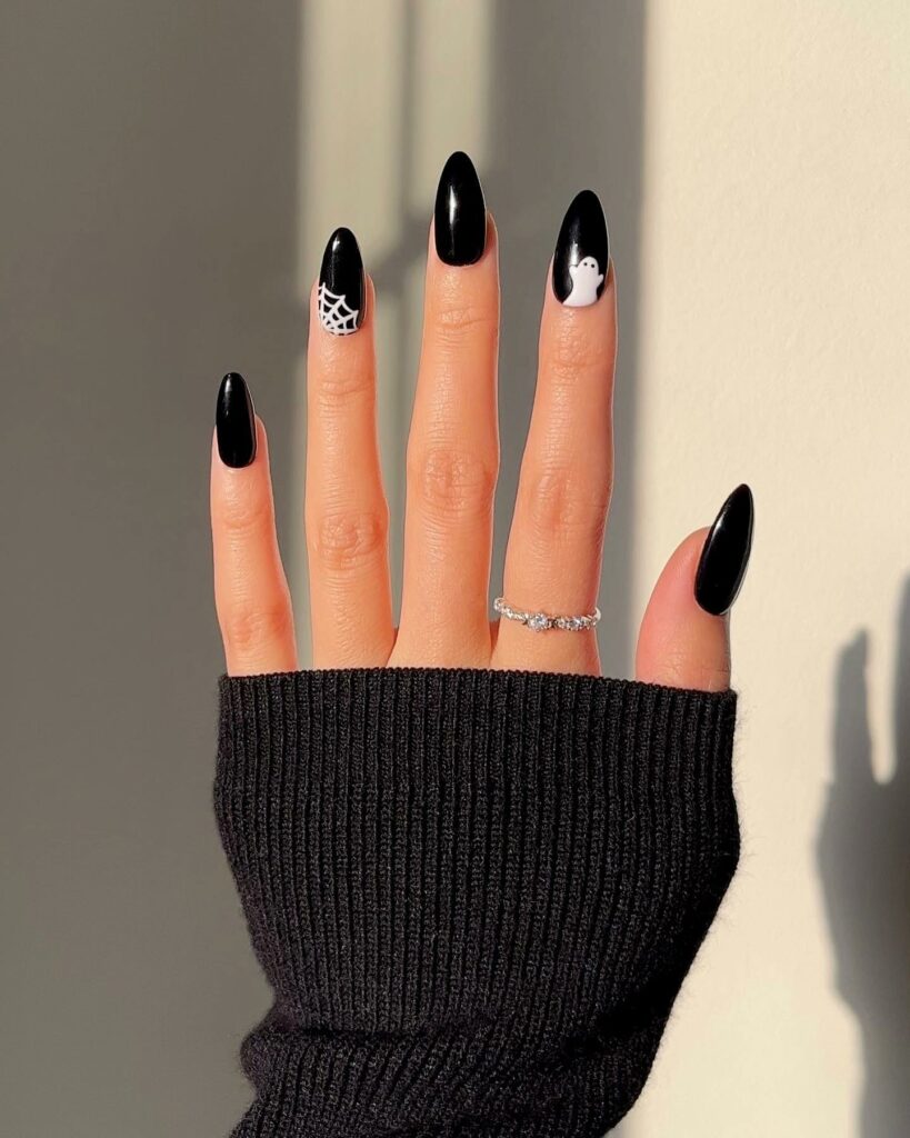 Get Spooky with 33 Black Halloween Nails To Try in 2024 13 Minimalistic Black Halloween Nails