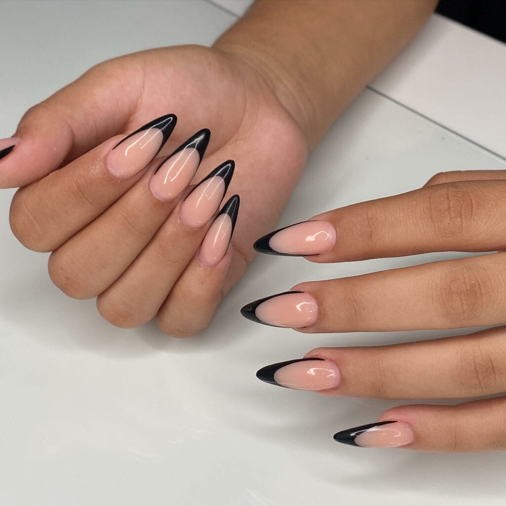 30 Latest Black Almond Nail Ideas To Try In 2024! 44 Soft Contrast with Nude Black Almond Nails