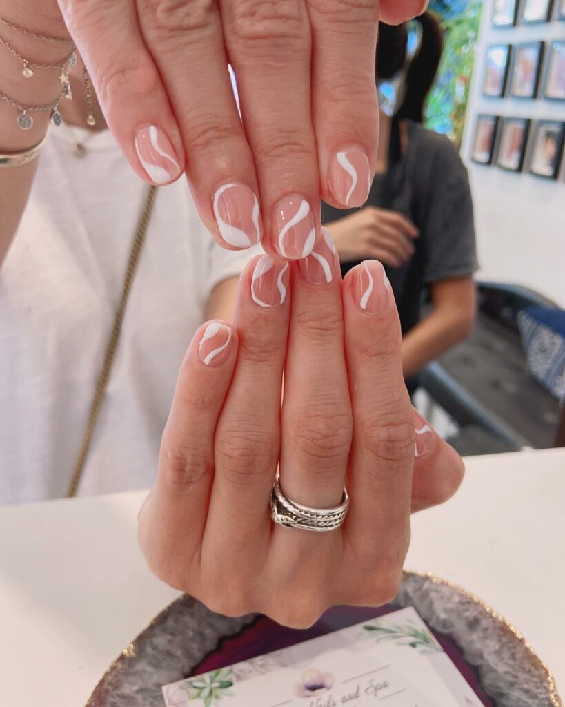 Get Creative with 39 Cute Short Nails Designs for 2024 10 Nude Nails With White Swirls instagram