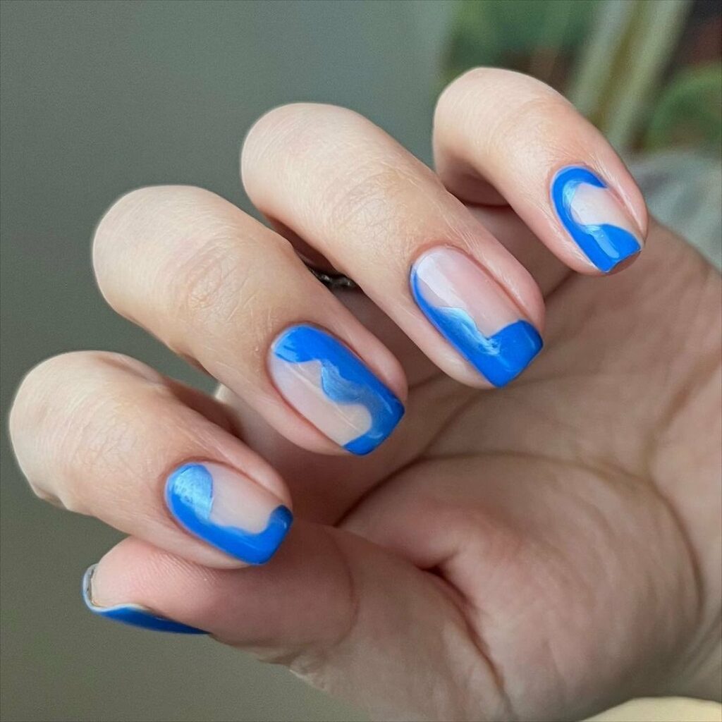 Experiment with 30 Stunning Blue Ombré Nails for 2024 22 Ocean Waves blue ombre nails
